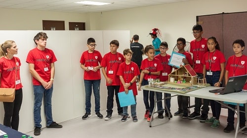 Maple Leaf International School Robo Pack prepare to present their innovative solution to the Project Judges